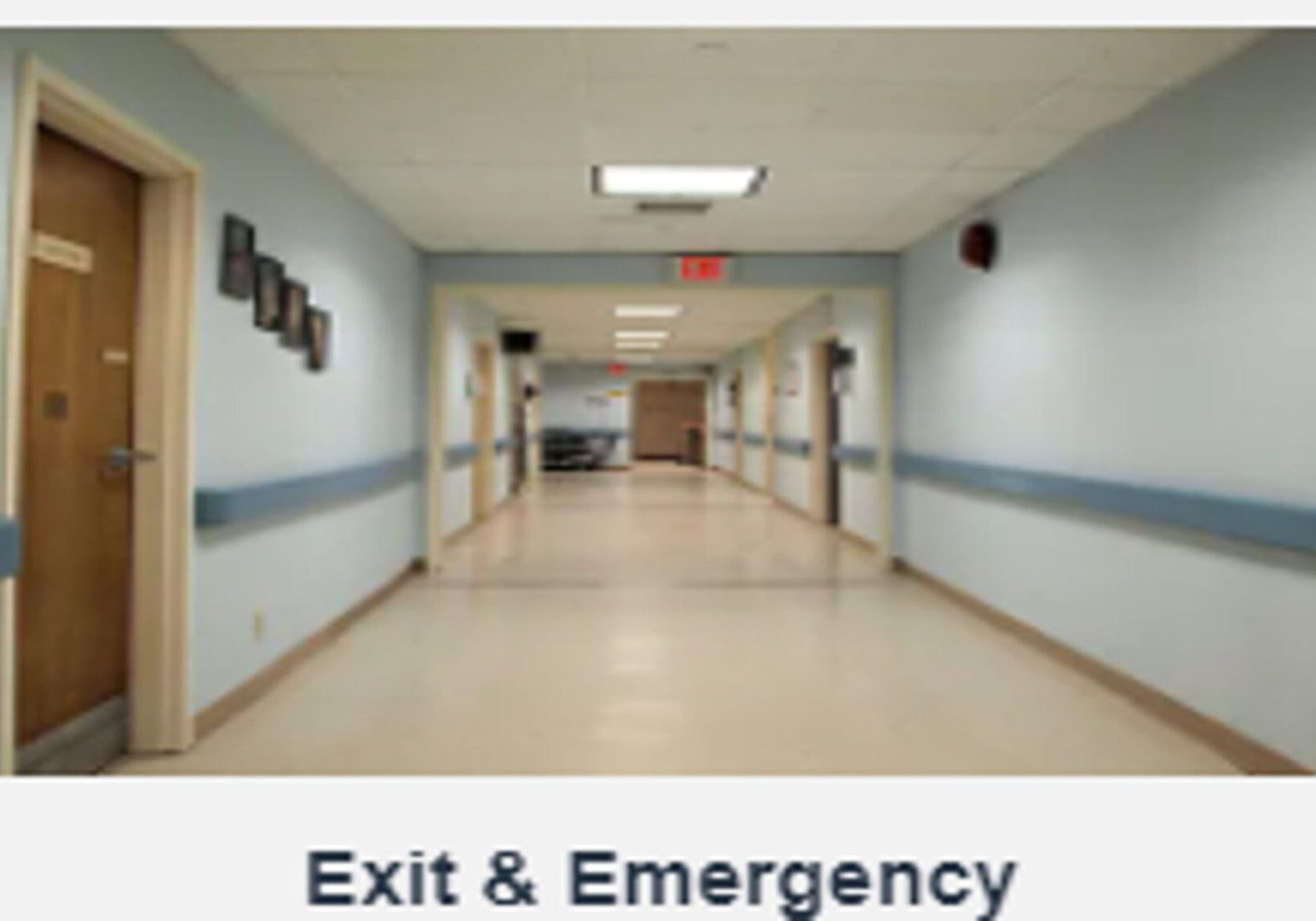 A hallway with the words " exit & emergency ".