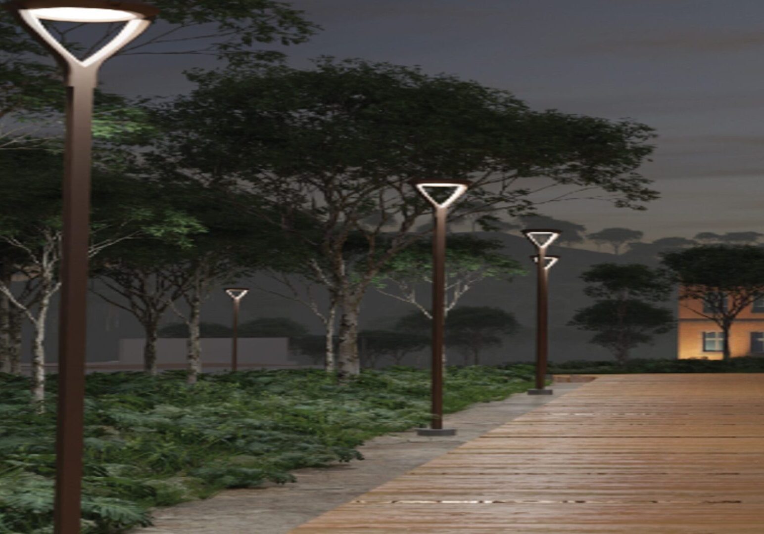 A rendering of the walkway at night with trees and lights.